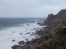 Rugged granite shoreline with rough seas