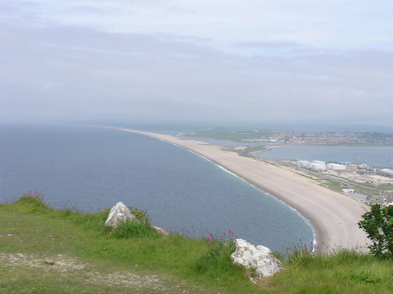 Long shingle beach stretching off towards the horizon.